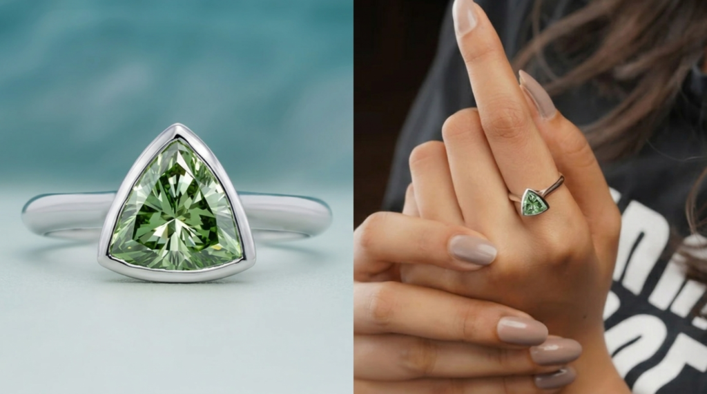 Lab grown green diamond engagement rings with a trillion cut green diamond set in a sleek silver band worn on hand.