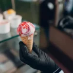 Customers choosing flavors at a nearby ice cream shop
