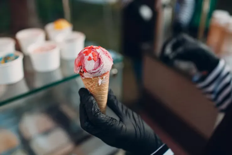 Customers choosing flavors at a nearby ice cream shop
